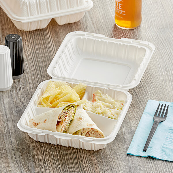 A white Choice plastic hinged take-out container with a sandwich, chips, and a drink.